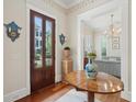 Welcoming foyer featuring hardwood floors, decorative accents, and a glimpse into the stylishly furnished living space at 28 Robert Mills Cir, Mount Pleasant, SC 29464