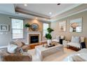 Cozy living room featuring a fireplace, hardwood floors, and stylish furnishings at 314 Freeland Way, Moncks Corner, SC 29461