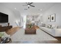 Bright, open-concept living space featuring hardwood floors, modern furnishings, and lots of natural light at 4067 S Rhett Ave, North Charleston, SC 29405