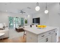 Open living area with a kitchen island, seamlessly blending living, dining, and kitchen spaces at 4067 S Rhett Ave, North Charleston, SC 29405