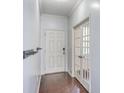 Bright entryway with hardwood floors, white doors, and modern coat rack at 531 Crossland Dr, Moncks Corner, SC 29461