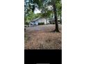 Charming home with a spacious front yard and attached garage at 5423 Buckeye Rd, Hollywood, SC 29449