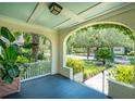 Inviting front porch with a view of the beautifully landscaped street and surrounding neighborhood at 66 Darlington Ave, Charleston, SC 29403