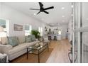 Bright open-concept living space with hardwood floors, natural light, and modern finishes with living room and kitchen at St, Charleston, SC 29407
