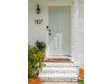 Close-up of the front door showing the house number, doorbell, and brick steps at 1107 S Shadow Dr, Mount Pleasant, SC 29464