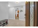 Inviting entryway featuring tile flooring, a shoe bench, and a view of the kitchen at 112 Fox Chase Dr, Goose Creek, SC 29445