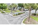 View of the Persimmon Point entrance sign, landscaping, and parking area at 1225 Blakeway St # 906, Charleston, SC 29492