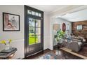 Bright entryway with wood floors, natural light, and a glimpse of the living room beyond at 1446 Burningtree Rd, Charleston, SC 29412