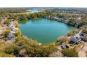 A beautiful aerial view of the lake community, showcasing lush trees at 1552 Harborsun Dr, Charleston, SC 29412