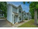 Attractive townhomes with light blue siding and well-kept lawns at 1686 Hunters Run Dr, Mount Pleasant, SC 29464