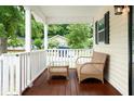 Relaxing front porch with wicker furniture, perfect for enjoying the outdoors at 1705 Bella Terra Ln, Charleston, SC 29412