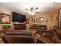 Cozy living room with a fireplace, ceiling fan, and comfortable seating at 1705 Bella Terra Ln, Charleston, SC 29412