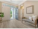 Welcoming foyer with elegant flooring, a comfortable bench, and bright natural light at 1800 Palmetto Isle Dr, Mount Pleasant, SC 29466