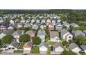 A picturesque aerial view displays a vibrant residential area with tree-lined streets at 209 Barberry St, Summerville, SC 29483