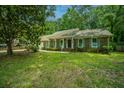 Charming brick home featuring well-maintained lawn, front porch, and colorful shutters at 215 Bramblewood Dr, Summerville, SC 29485