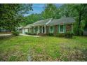 Charming brick home featuring well-maintained lawn, front porch, and colorful shutters at 215 Bramblewood Dr, Summerville, SC 29485