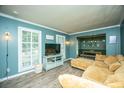 Comfortable living room featuring natural light, plush couch, and stylish decor at 215 Bramblewood Dr, Summerville, SC 29485