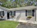 Charming house with stone accents, flower boxes, neat lawn and newly planted garden at 2174 Eleanor Dr, North Charleston, SC 29406