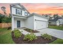 The property has a two-car garage and neat landscaping at 224 Wappoo Trace Ln, Summerville, SC 29486