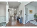 Grand foyer with dark hardwood floors and white walls leading to living spaces and stairs at 240 Mayfield Dr, Goose Creek, SC 29445