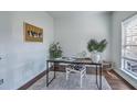 Bright home office with a simple desk, stylish chair, and natural light from the window at 240 Mayfield Dr, Goose Creek, SC 29445