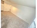 Bright living room with neutral carpet and fresh white walls at 2494 Etiwan Ave # 9-D, Charleston, SC 29414