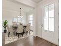 Elegant dining room with modern chandelier, round table, and comfortable seating, creating a welcoming atmosphere at 2582 Kingsfield St, Mount Pleasant, SC 29466