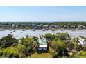 Breathtaking aerial view showcasing waterfront property with private docks and expansive water views reaching the ocean at 2619 Buccaneer Rd, Isle of Palms, SC 29451