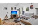 Cozy living room with vaulted ceilings, stylish decor, and a comfortable seating arrangement perfect for relaxation at 303 Gippy Dr, Summerville, SC 29486