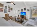 Inviting living room featuring vaulted ceilings, eclectic artwork, and comfortable furniture at 303 Gippy Dr, Summerville, SC 29486