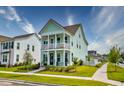 Beautiful two-story home with a double covered porch, showcasing outdoor living space at 312 Clearpath Dr, Summerville, SC 29486