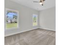 Spacious bedroom with carpet flooring and large windows offering abundant natural light at 3214 Pinewood Dr, Ladson, SC 29456