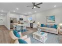 Open-concept living area with a modern kitchen, dining space, and a comfortable seating area at 3214 Pinewood Dr, Ladson, SC 29456