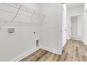 Functional laundry room with shelving and ample space for appliances and storage at 3218 Pinewood Dr, Ladson, SC 29456
