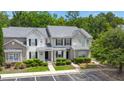 Aerial view showcases the townhouse with a gray roof, landscaping, and parking at 333 Flyway Rd, Goose Creek, SC 29445