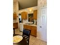 Kitchen featuring tiled floors, a sink under the window and lots of wooden cabinets at 3415 Pawtucket St, Charleston, SC 29414