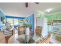 Open-concept layout connects the dining area and kitchen, enhancing flow and functionality in this charming home at 444 Clarine Dr, Goose Creek, SC 29445