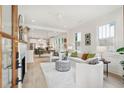 Bright and airy living room with a fireplace, opening to the kitchen and dining area at 4620 O'Hear Ave, North Charleston, SC 29405