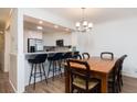 Open concept dining area with breakfast bar and modern lighting at 509 Summerhouse, Isle of Palms, SC 29451