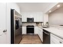 Updated kitchen with stainless steel appliances, granite countertops, and ample cabinet space at 509 Summerhouse, Isle of Palms, SC 29451