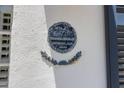 Historic plaque on a building exterior shows the year 1670 and a detailed emblem at 8 & 8 1/2 Elliott St # 8 & 8 1/2, Charleston, SC 29401