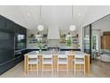 Modern kitchen features a marble island, open shelving, and professional-grade appliances at 926 Pitt St, Mount Pleasant, SC 29464