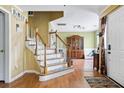 Bright foyer featuring hardwood floors and staircase leading to the second floor at 103 Retriever Ln, Goose Creek, SC 29445
