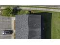 Aerial view of a roof and parking lot showcasing proximity to a nearby well manicured lawn at 1034 Lexi Ct, Ladson, SC 29456