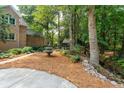 Private backyard with a fountain and a serene wooded area at 125 Drayton Dr, Summerville, SC 29483