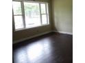 Inviting bedroom with a large window providing plenty of natural light and vinyl flooring at 1277 Russellville Rd, Saint Stephen, SC 29479