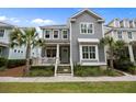 Inviting home featuring a cozy porch, lush landscaping, and a well-maintained lawn for curb appeal at 1557 Kepley Dr, Mount Pleasant, SC 29464
