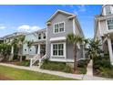 Charming two-story home boasts manicured landscaping, a welcoming porch, and classic architectural details at 1557 Kepley Dr, Mount Pleasant, SC 29464