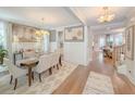 Elegant dining room featuring a modern chandelier and hardwood floors at 157 Village Ponds Dr, Summerville, SC 29483