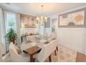 Bright dining area with stylish decor and a large table for gatherings at 157 Village Ponds Dr, Summerville, SC 29483